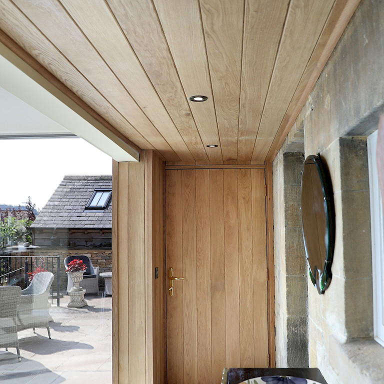 Bespoke Oak door with oak panelling